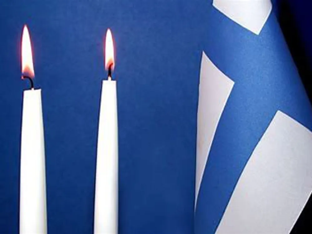 Stearinljus och flagga