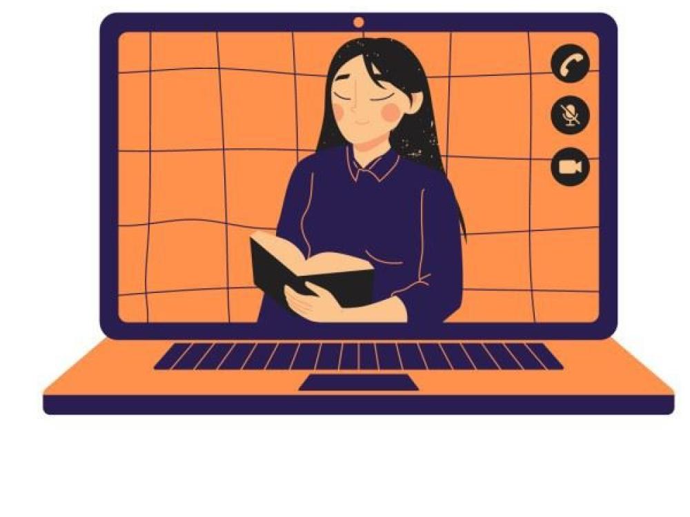 Flicka läser bok på dataskärm